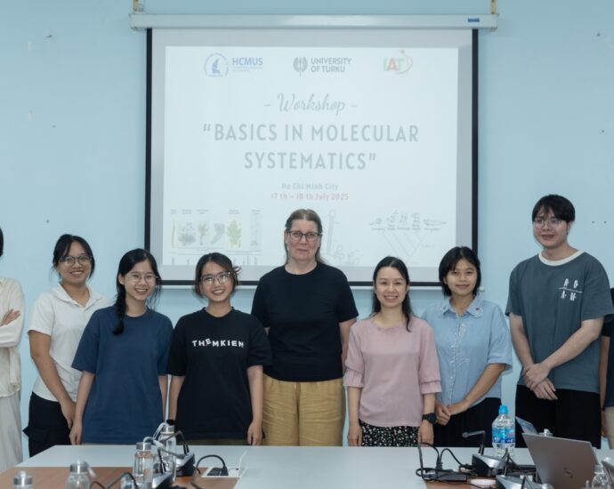 A group of people standing in front of a white board AI-generated content may be incorrect.